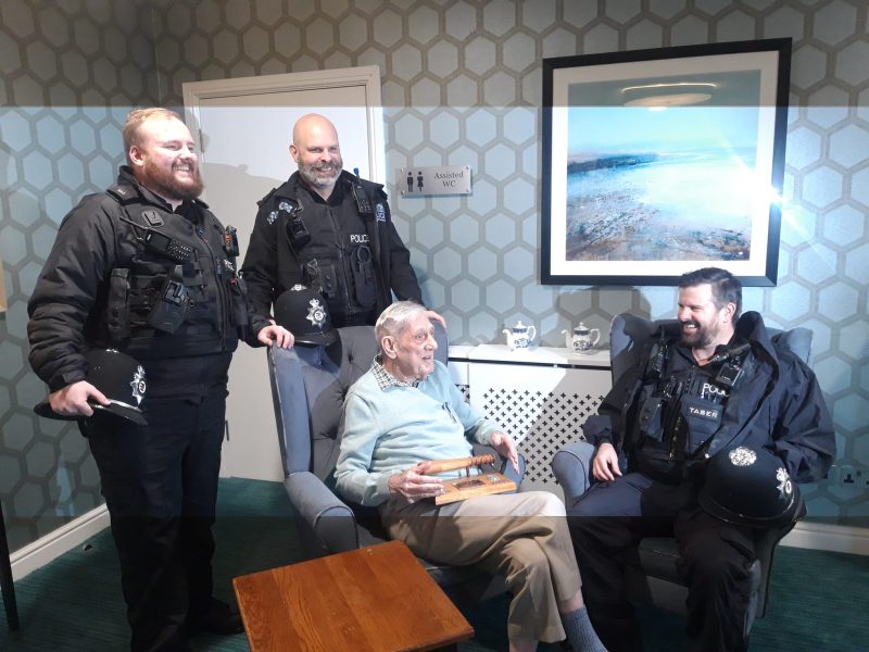 George Headley at Kingswood Court with local police officers