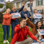 The People's Postcode Lottery Millionaire Street winners celebrate with Danyl Johnson