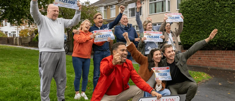 The People's Postcode Lottery Millionaire Street winners celebrate with Danyl Johnson