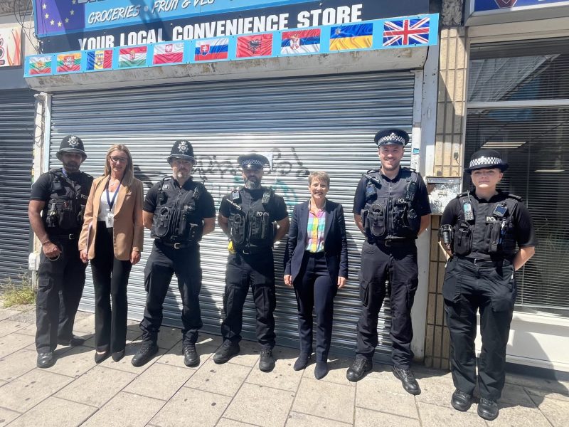 Police and Crime Commissioner Clare Moody with officers and council officials at the closed mini market