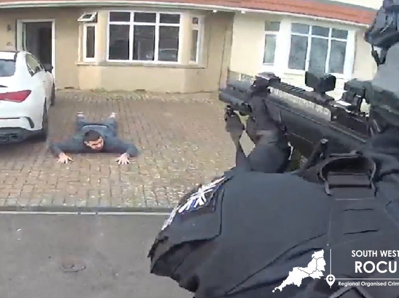 Ellis Kow is arrested outside his home in Kingswood